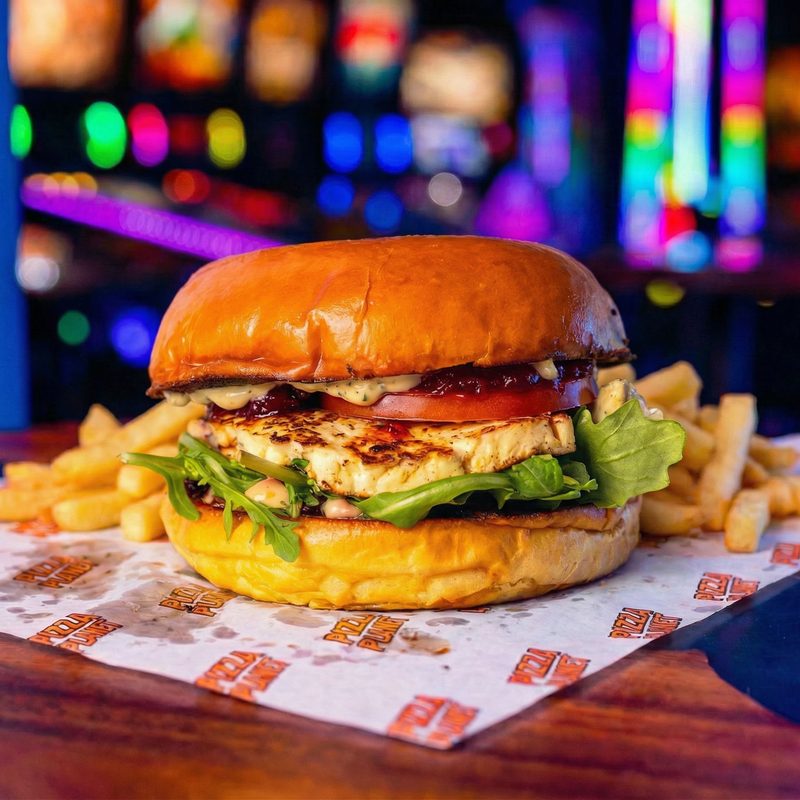 Halloumi Heist - grilled halloumi with chilli jam and rocket on a brioche bun with fries.
