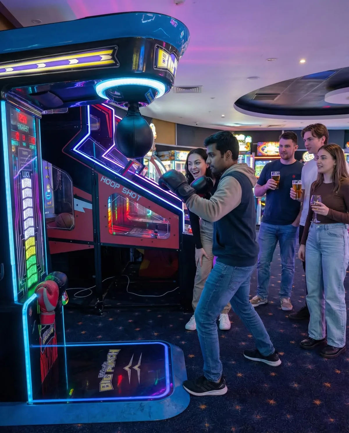 Guests playing the Big Punch boxing arcade game at a function