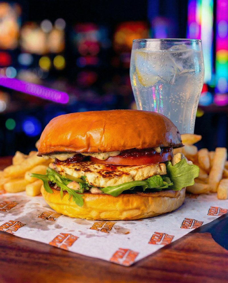 Halloumi Heist lunch deal - grilled halloumi with rocket and tomato chutney, served with chips and a sparkling drink.